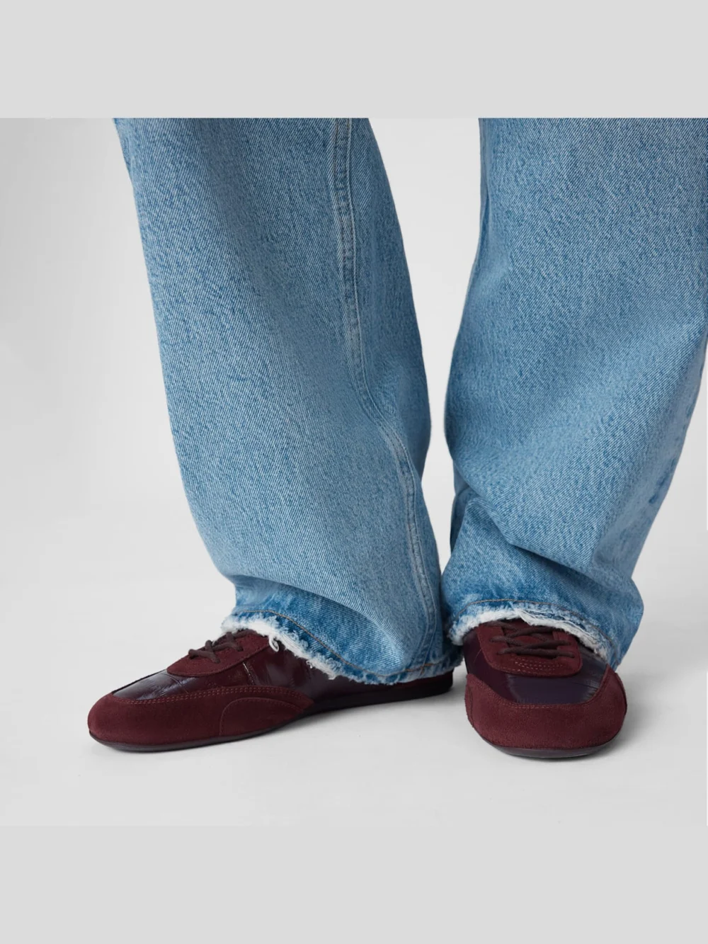 Close-up detail of the Jimmy Choo Sunny F Deep Merlot Leather Mix and Eel Printed Leather Low Top Trainers