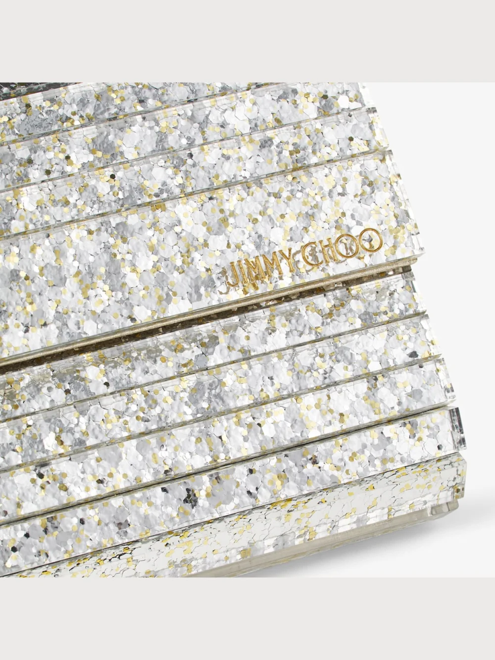Close-up detail of the Jimmy Choo Sweetie Champagne Coarse Glitter Acrylic Clutch Bag