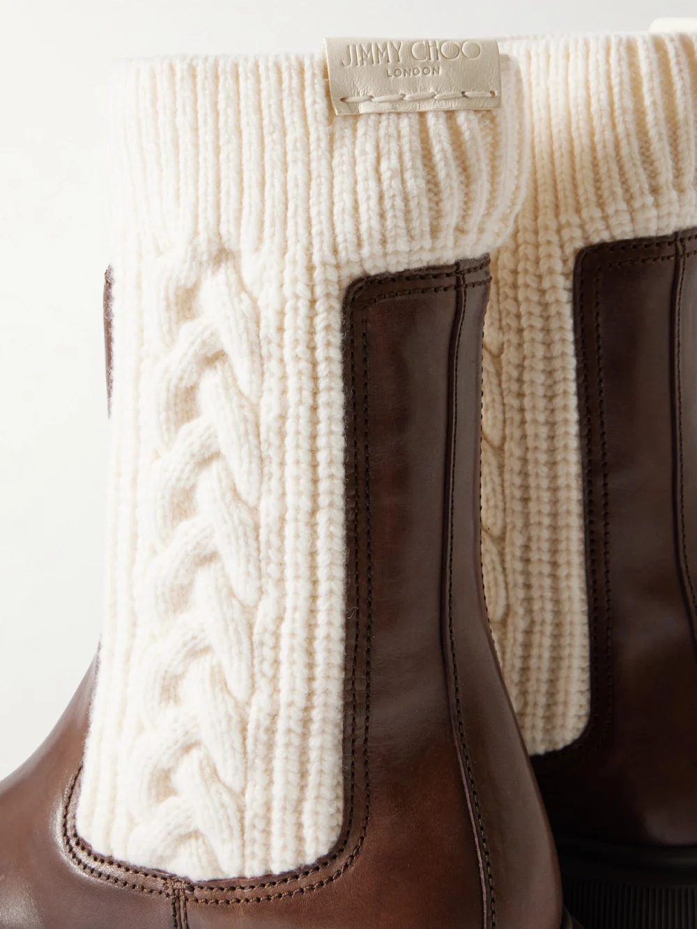 Close-up detail of the Jimmy Choo Tamia 70 Cable-knit Wool and Leather Chelsea Boots