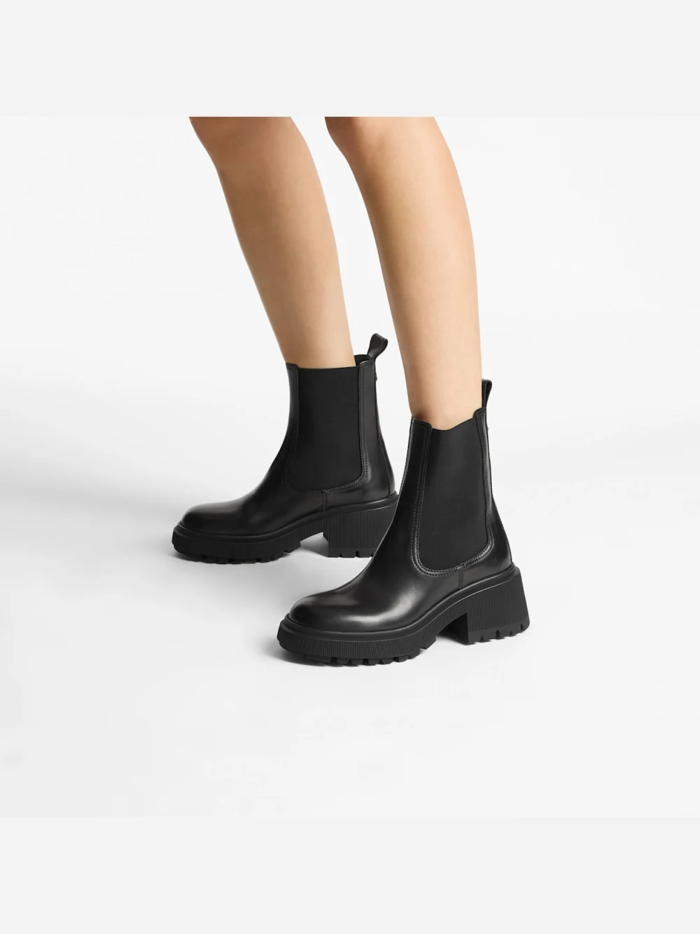 Side view of the Jimmy Choo Tamia Chelsea Flat Black Shiny Calf Leather Chelsea Boots