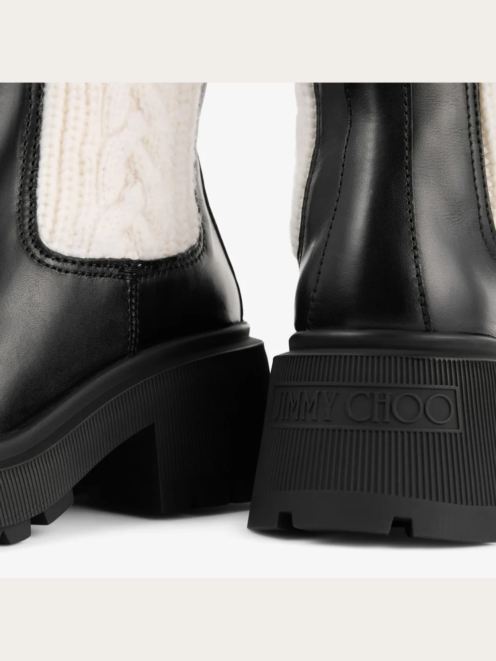 Back view of the Jimmy Choo Tamia Flat Black and Latte Shiny Calf Leather and Cable Knit Wool Chelsea Boots