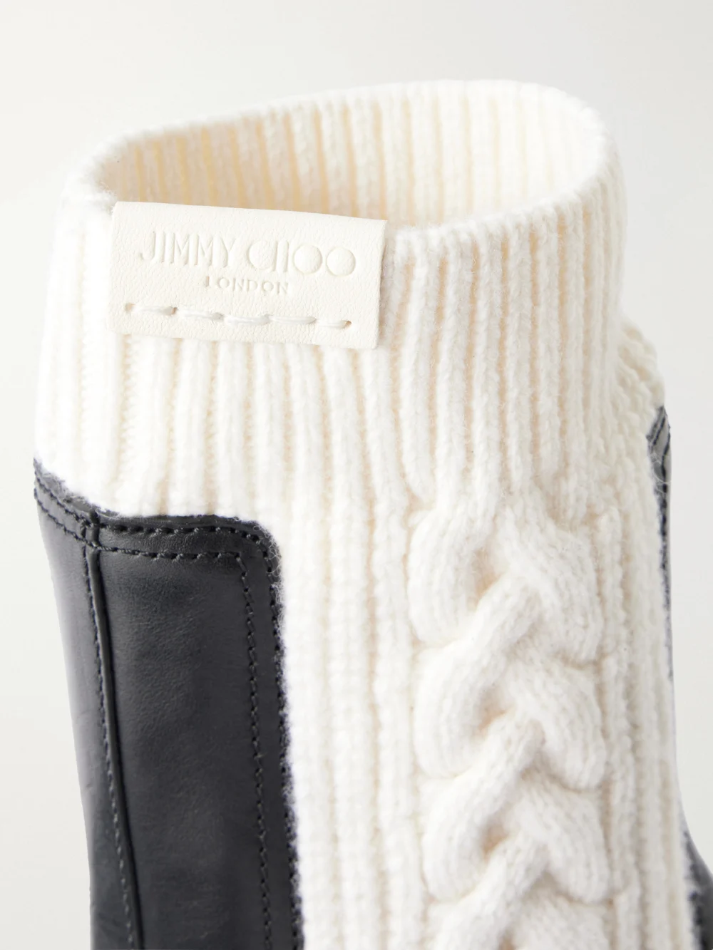 Close-up detail of the Jimmy Choo Tamia Ribbed Cable-knit-trimmed Leather Ankle Boots