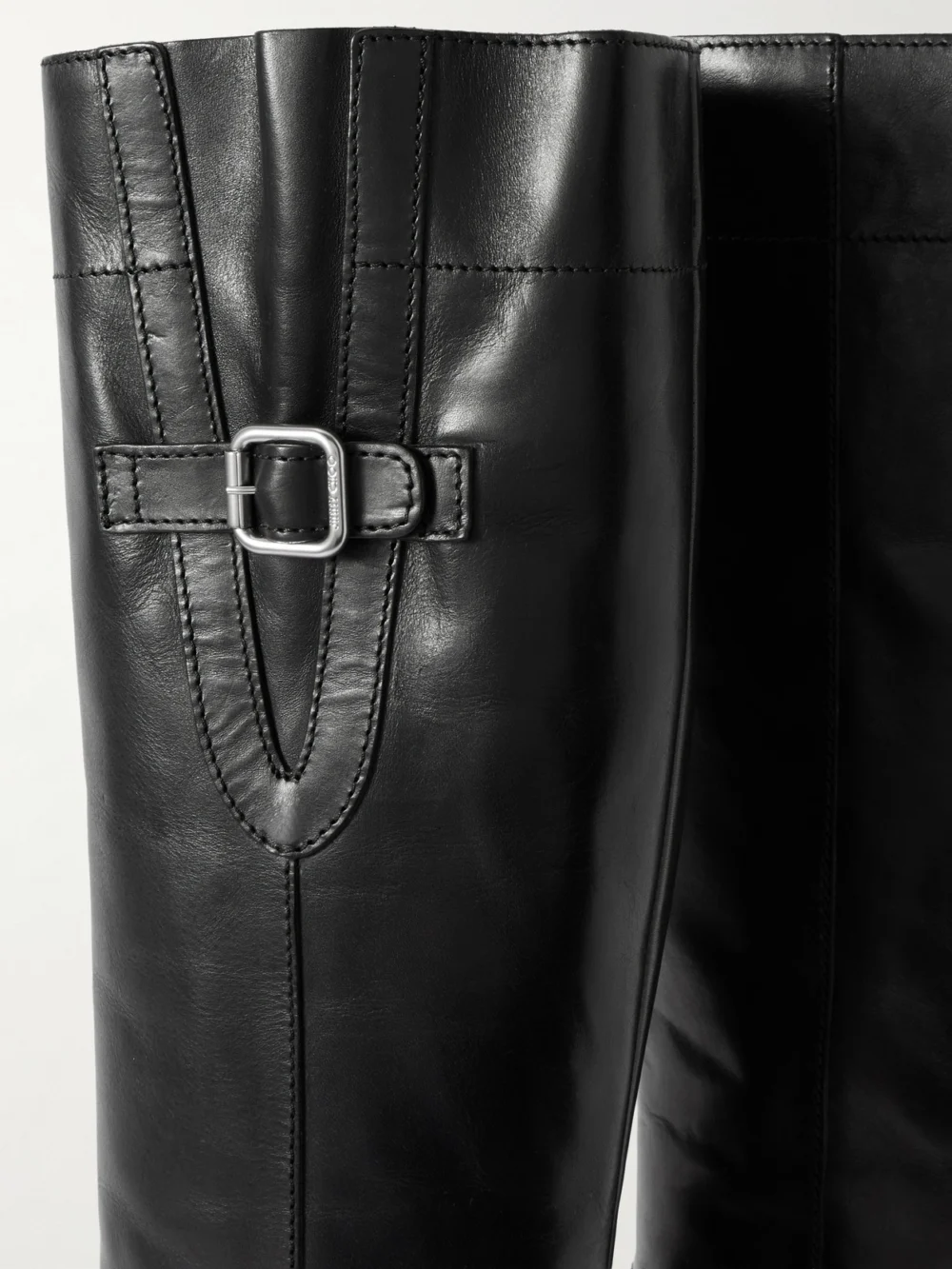 Close-up detail of the Jimmy Choo Tasmin 70 Buckled Glossed-leather Knee Boots