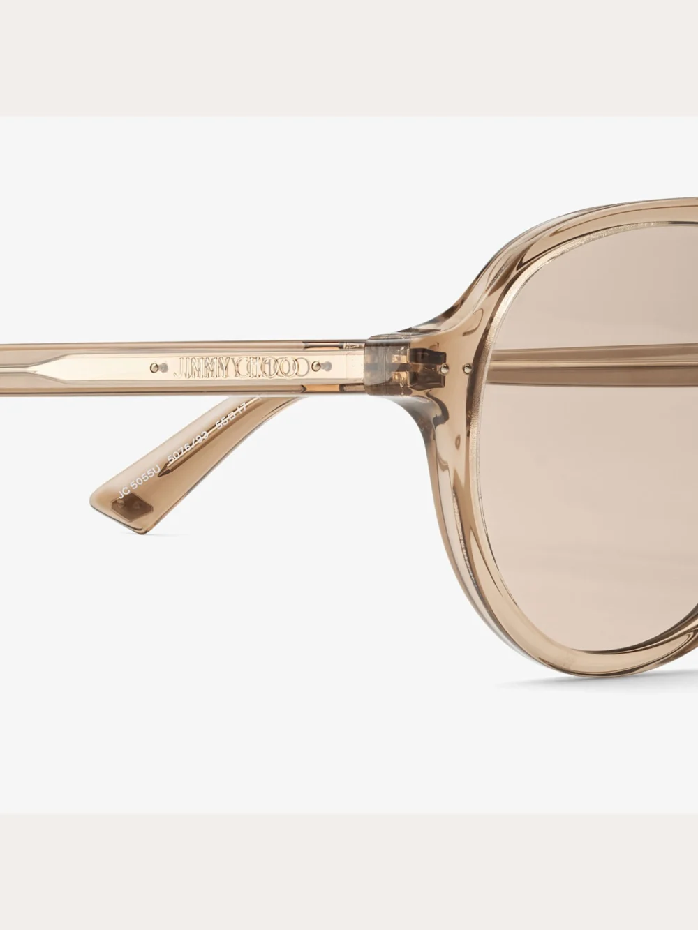 Close-up detail of the Jimmy Choo Vira Transparent Tan Aviator Sunglasses