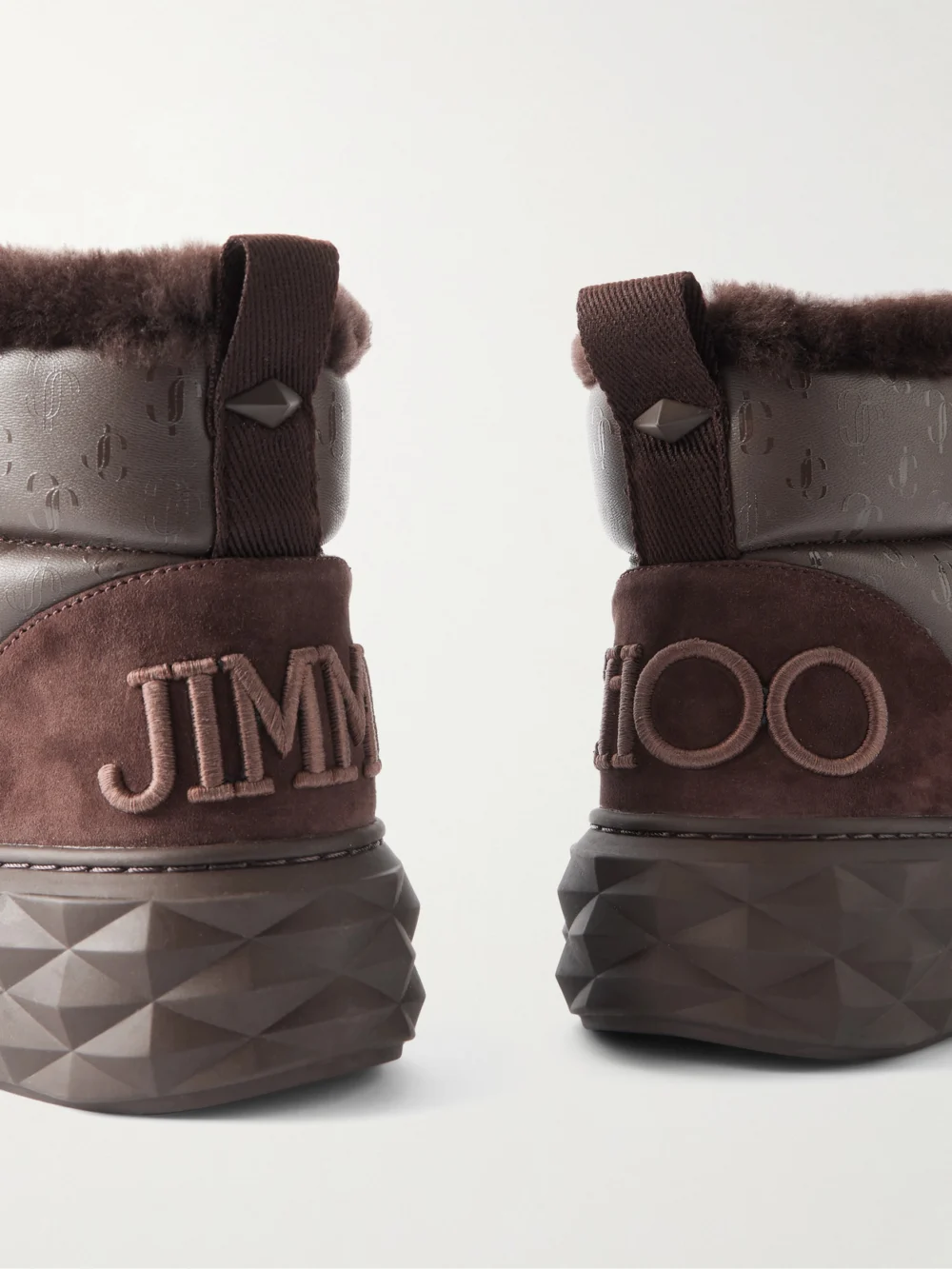 Close-up detail of the Jimmy Choo Xan Shearling-lined Quilted Logo-embossed Leather Boots
