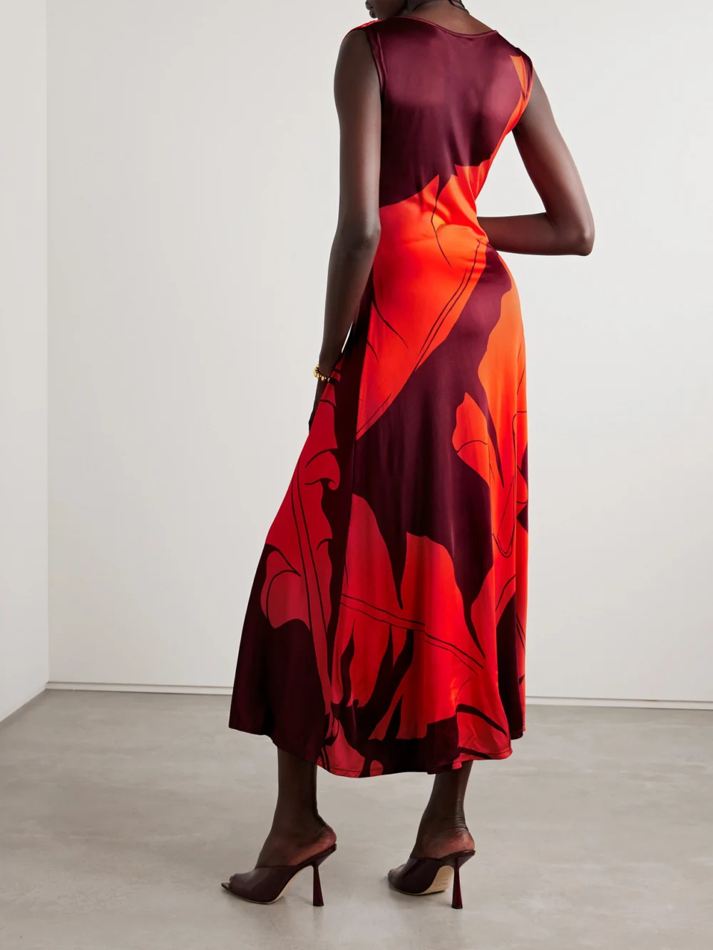 Back view of the Johanna Ortiz Deep Heart Twist-front Cutout Printed Stretch-jersey Midi Dress
