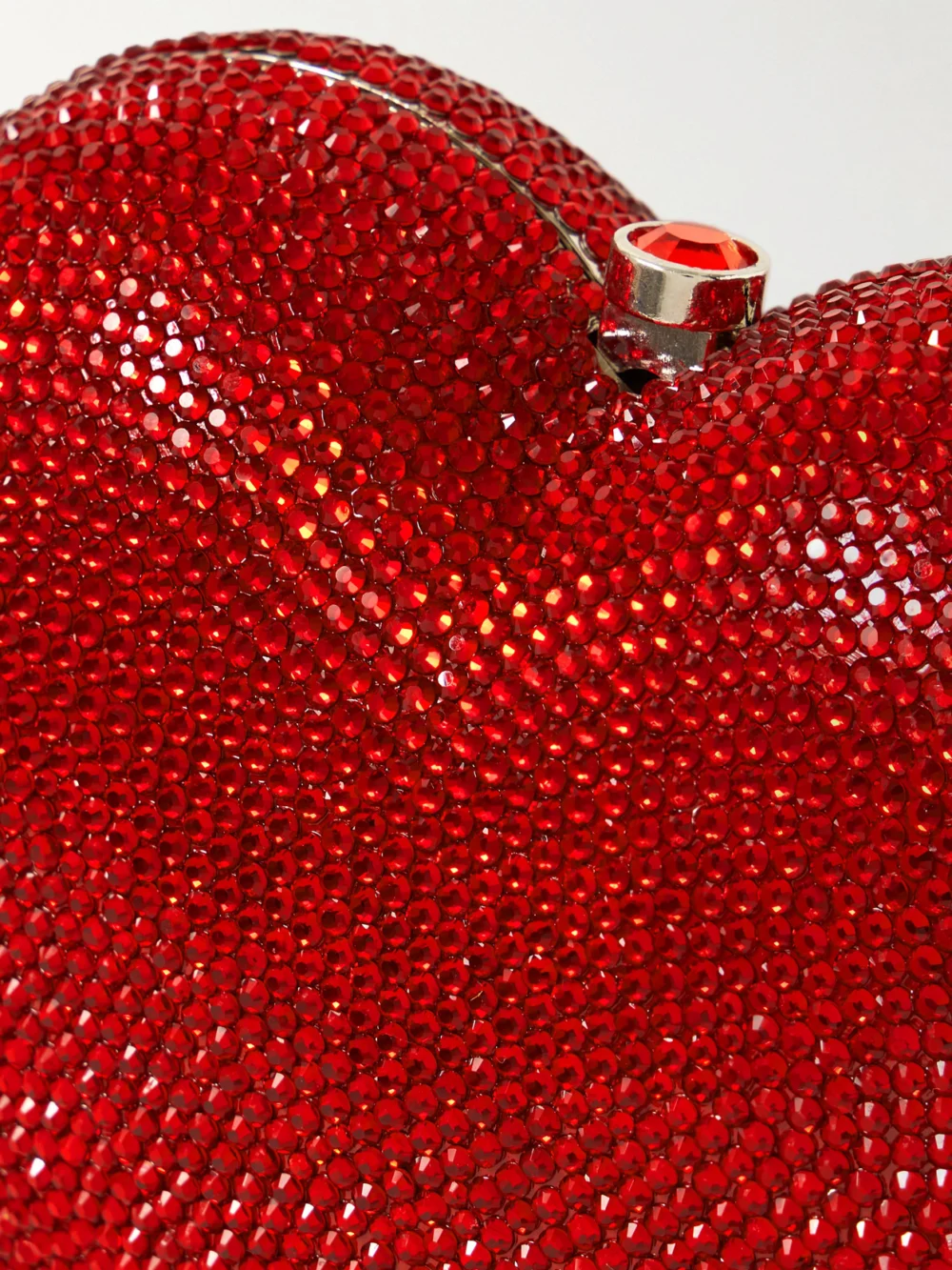 Close-up detail of the Judith Leiber Couture Petit Coeur Crystal-embellished Silver-tone Clutch