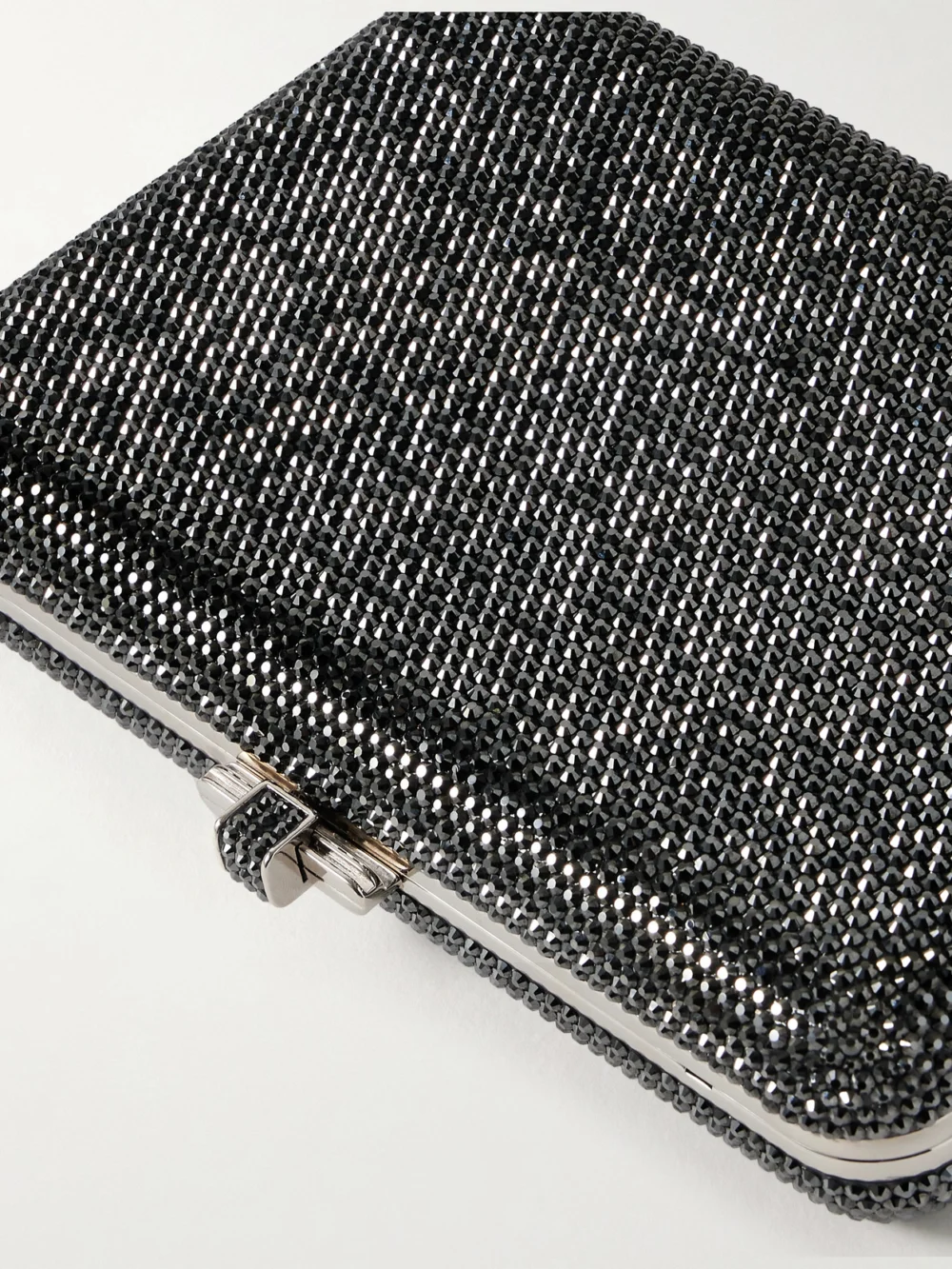 Close-up detail of the Judith Leiber Couture Slim Slide Crystal-embellished Silver-tone Clutch