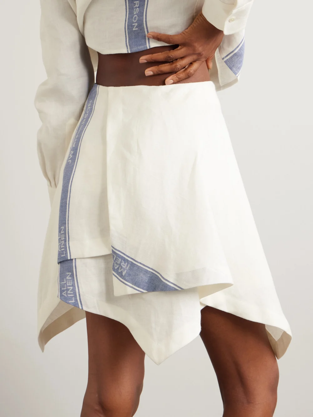 Back view of the JW Anderson Asymmetric Linen-jacquard Mini Wrap-effect Skirt