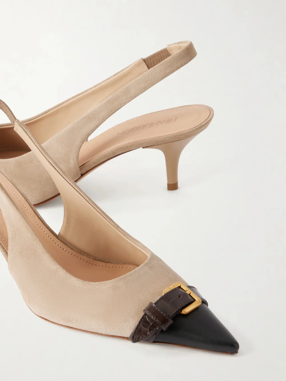 Close-up detail of the JW Anderson Buckled Leather-trimmed Suede Slingback Pumps