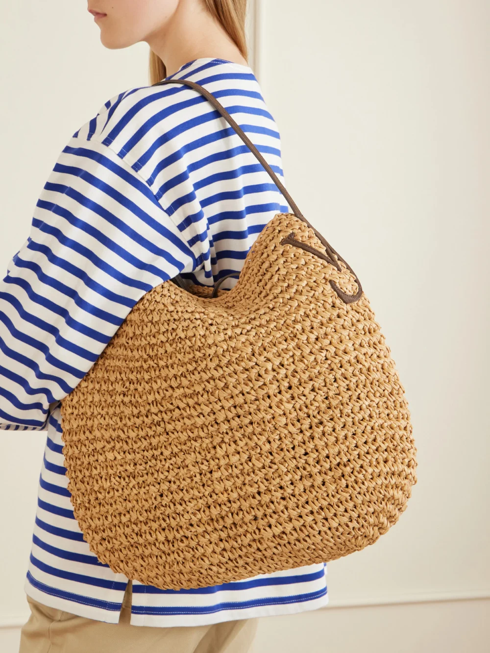 JW Anderson Bulb Large Suede-trimmed Raffia Tote, styled view