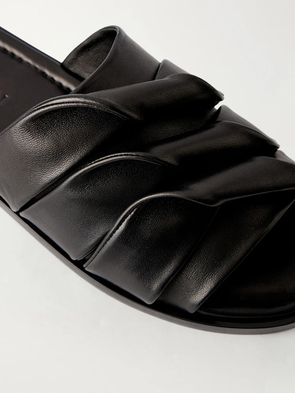 Close-up detail of the JW Anderson Coil Leather Slides
