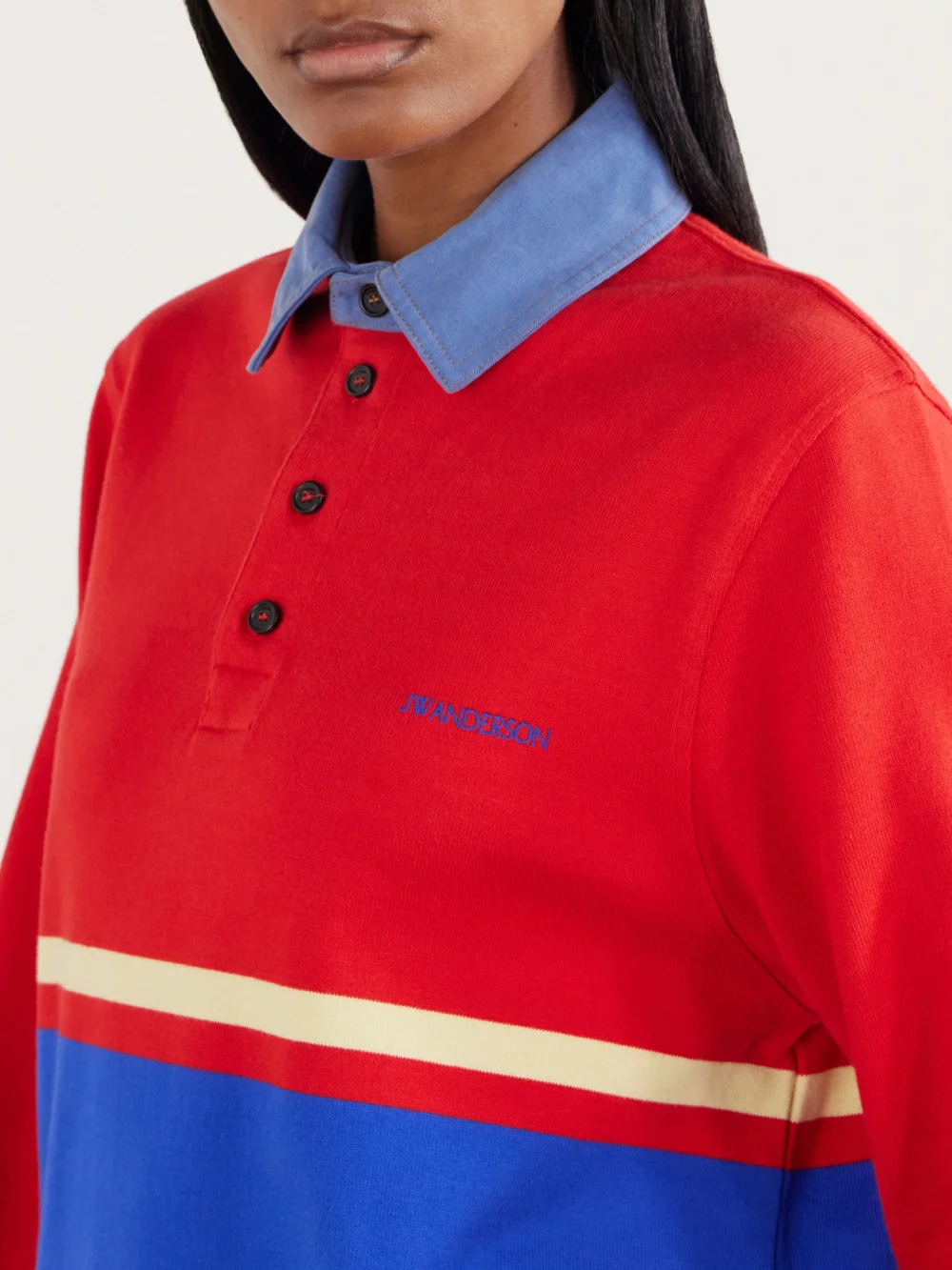 Close-up detail of the JW Anderson Contrast Collar Embroidered Striped Cotton-jersey Polo Shirt