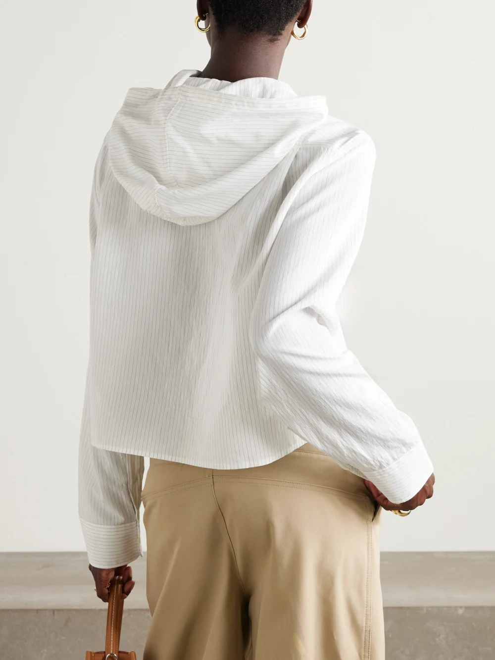 Back view of the JW Anderson Cropped Hooded Pinstriped Poplin Shirt
