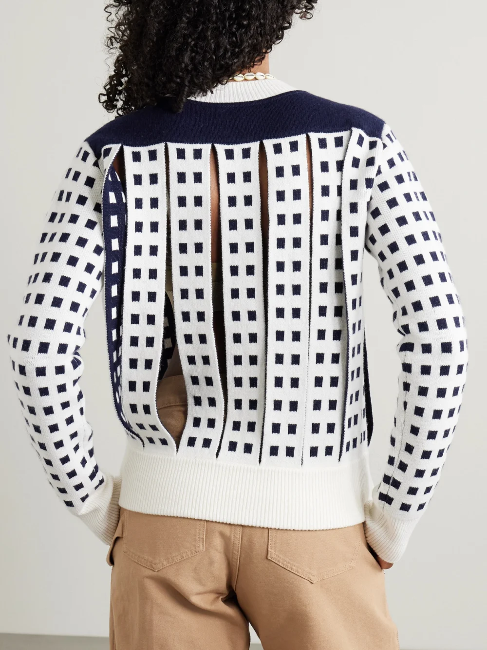 Back view of the JW Anderson Cutout Jacquard-knit Sweater