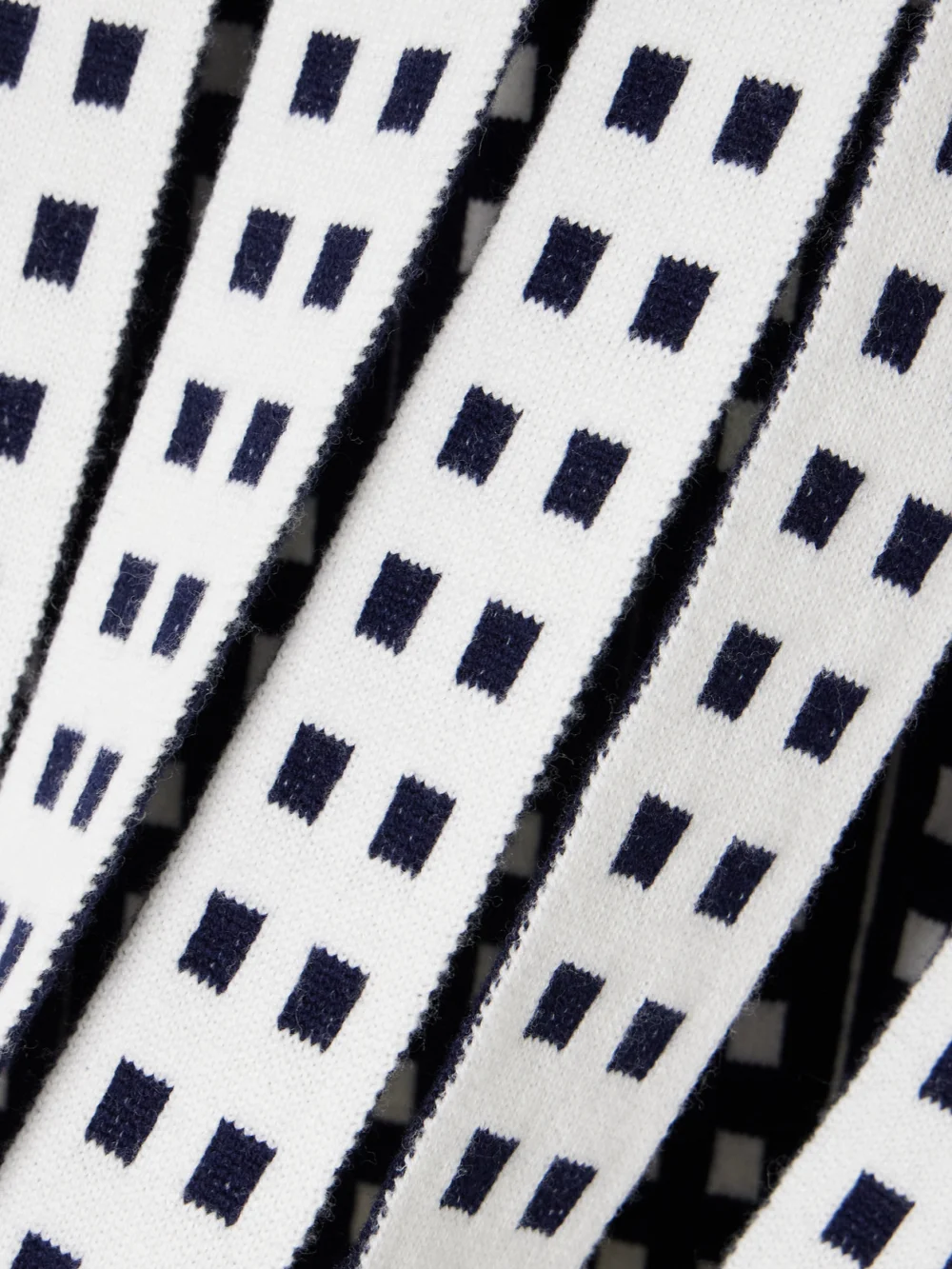 Close-up detail of the JW Anderson Cutout Jacquard-knit Sweater