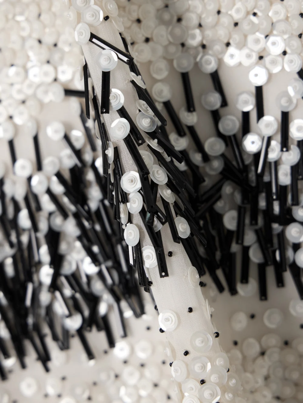 Close-up detail of the JW Anderson Embellished Chiffon Mini Dress