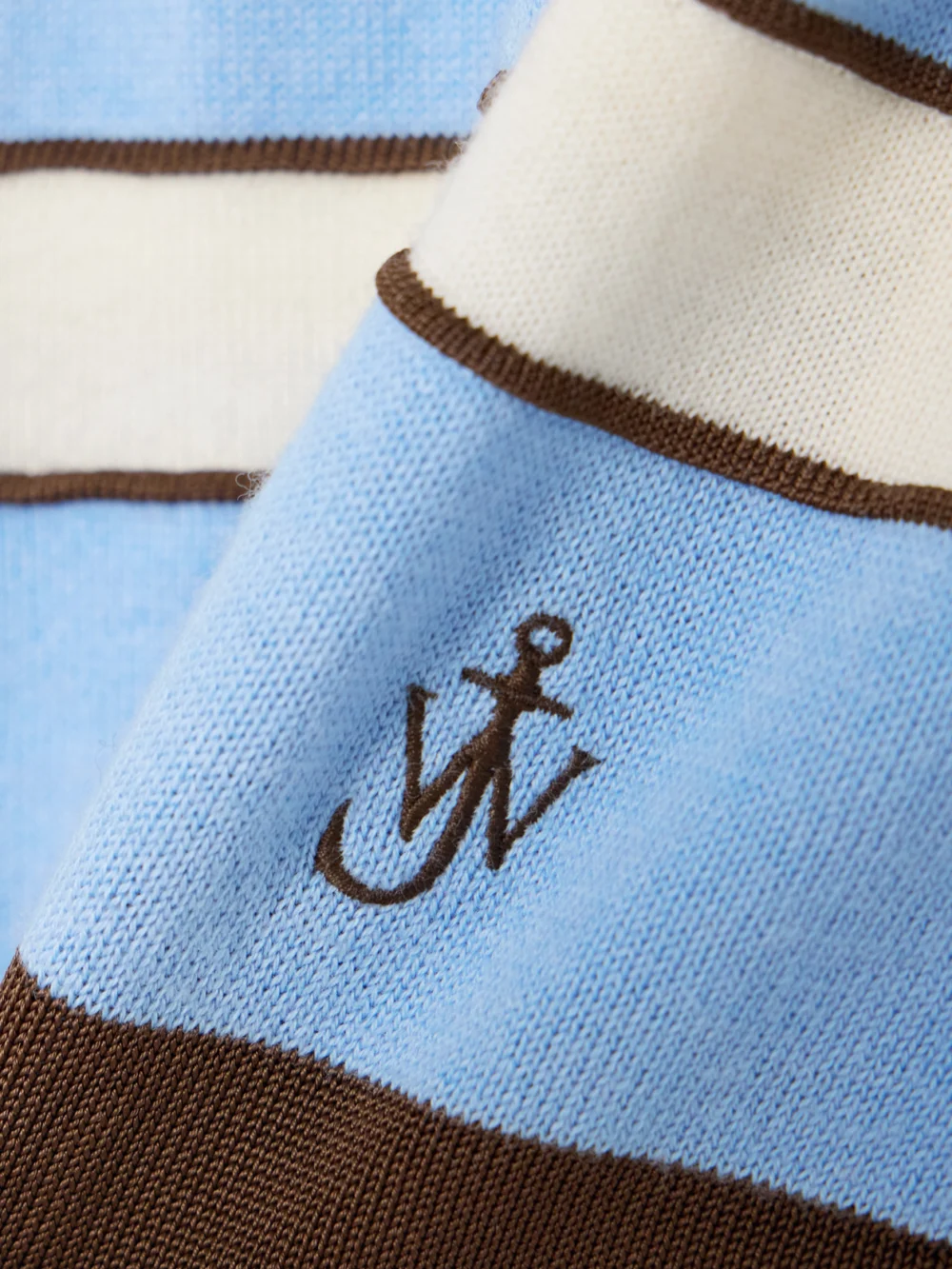 Close-up detail of the JW Anderson Embroidered Striped Cotton and Wool-blend Polo Shirt