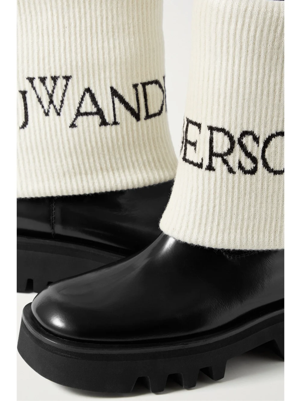 Close-up detail of the JW Anderson Fisherman Wool Jacquard-trimmed Glossed-leather Ankle Boots