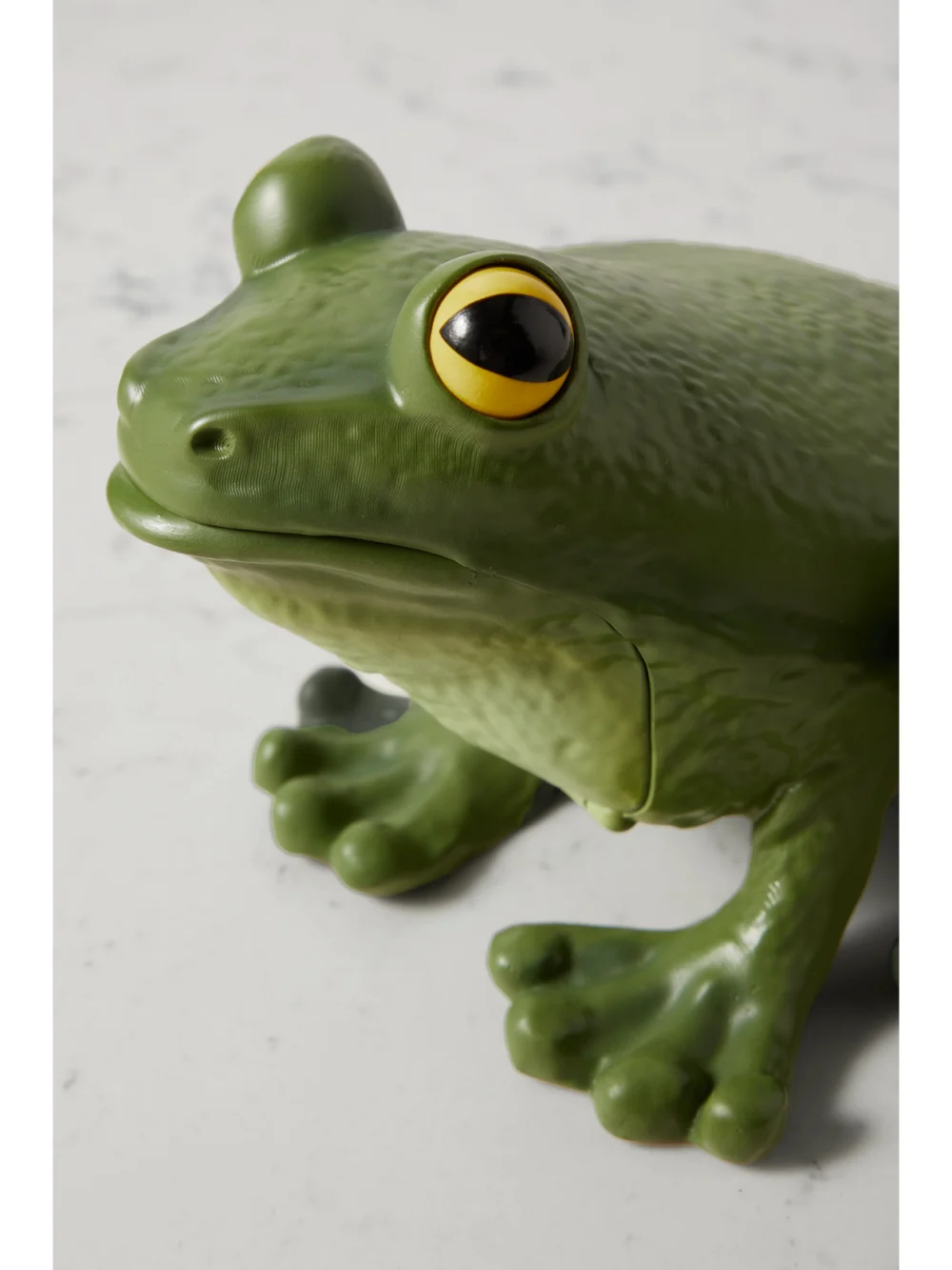 Close-up detail of the JW Anderson Frog Resin Clutch