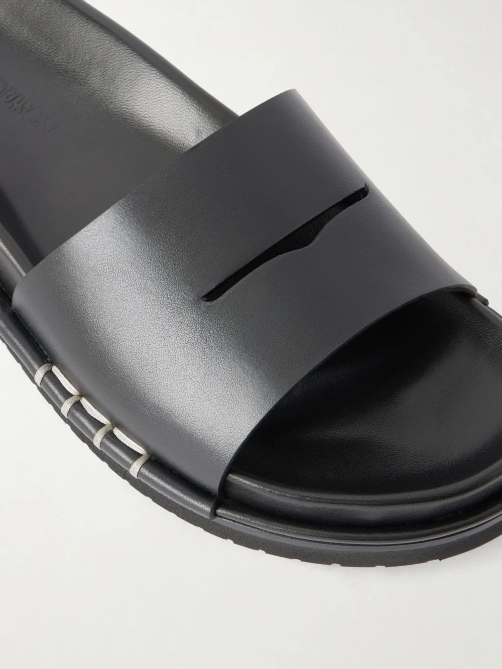 Close-up detail of the JW Anderson Fussbett Leather Slides