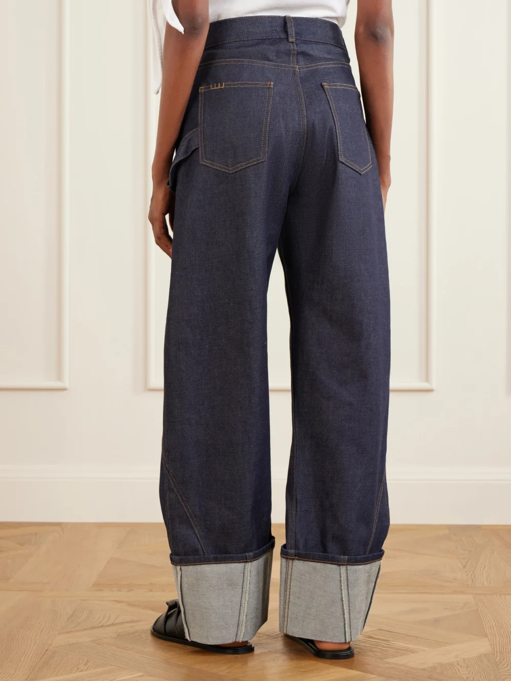 Back view of the JW Anderson High-rise Embroidered Wide-leg Jeans