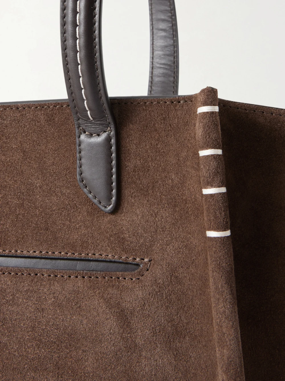 Close-up detail of the JW Anderson Loafer Cabas Leather-trimmed Suede Tote