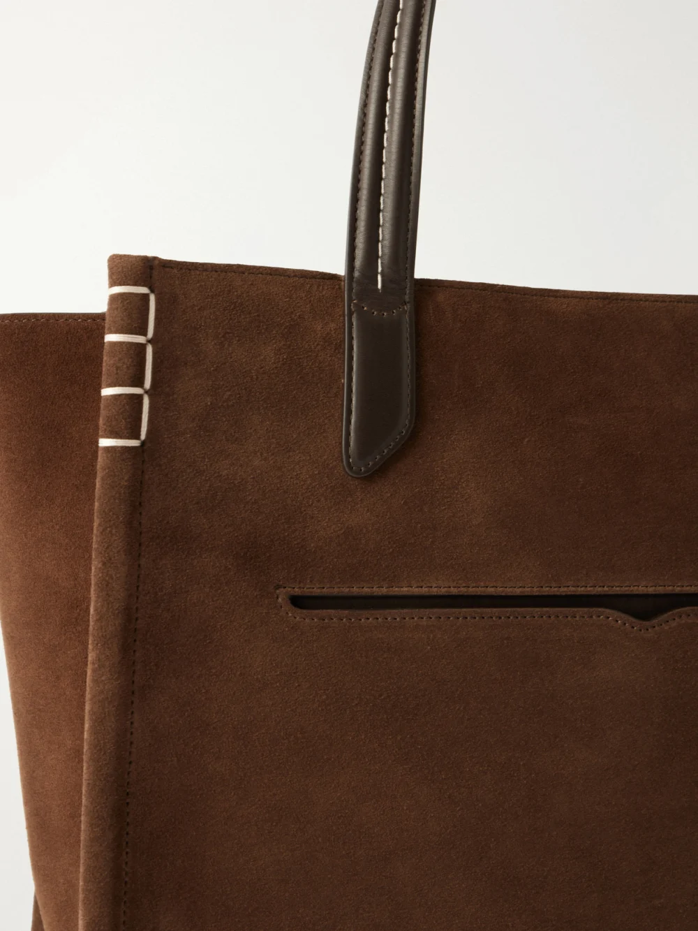 Close-up detail of the JW Anderson Loafer Cabas Leather-trimmed Suede Tote