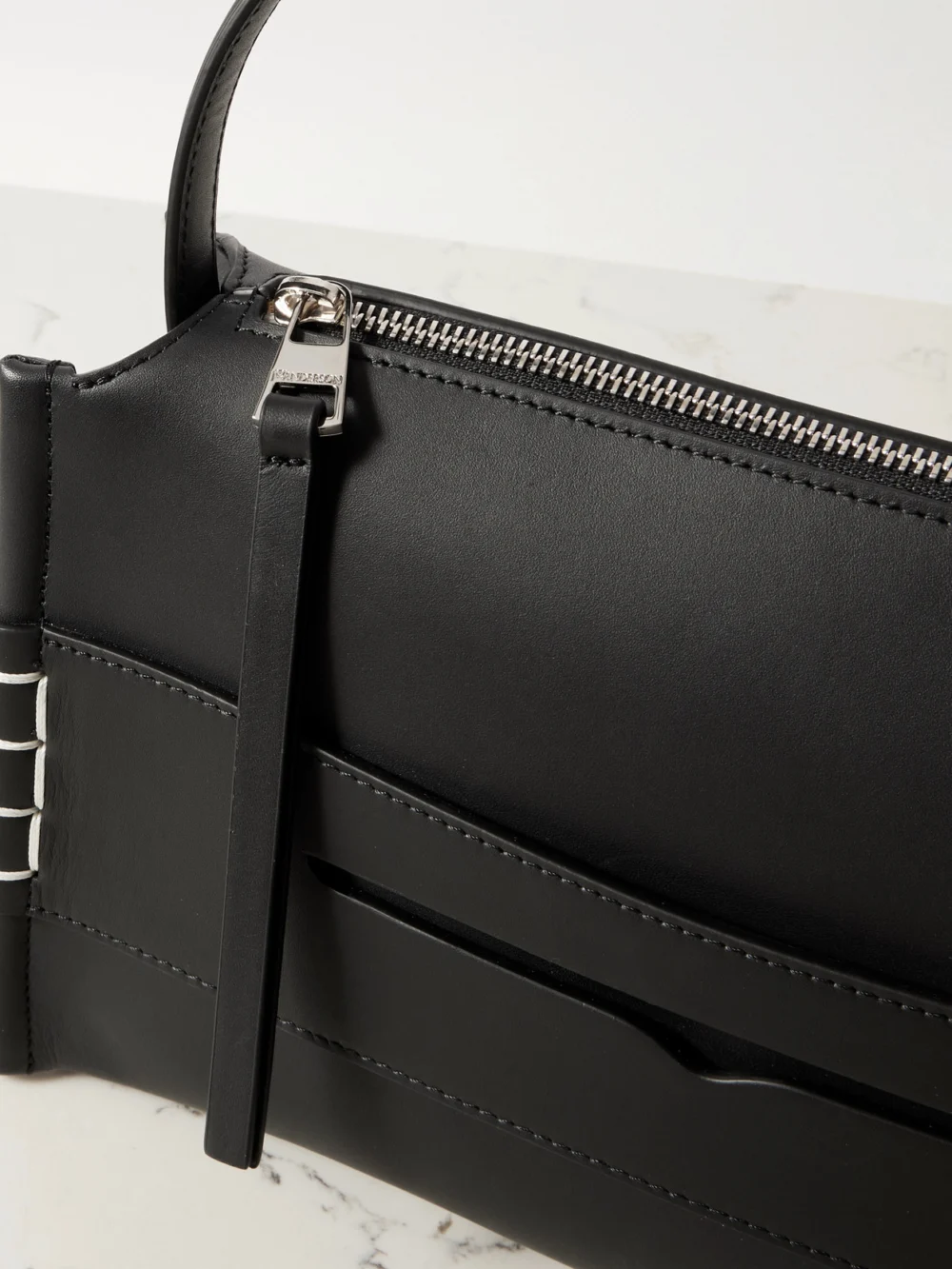 Close-up detail of the JW Anderson Loafer Embroidered Leather Shoulder Bag