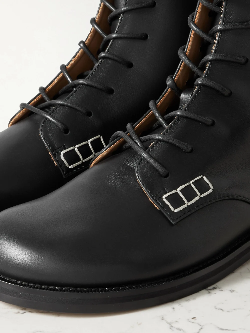 Close-up detail of the JW Anderson Loafer Leather Ankle Boots