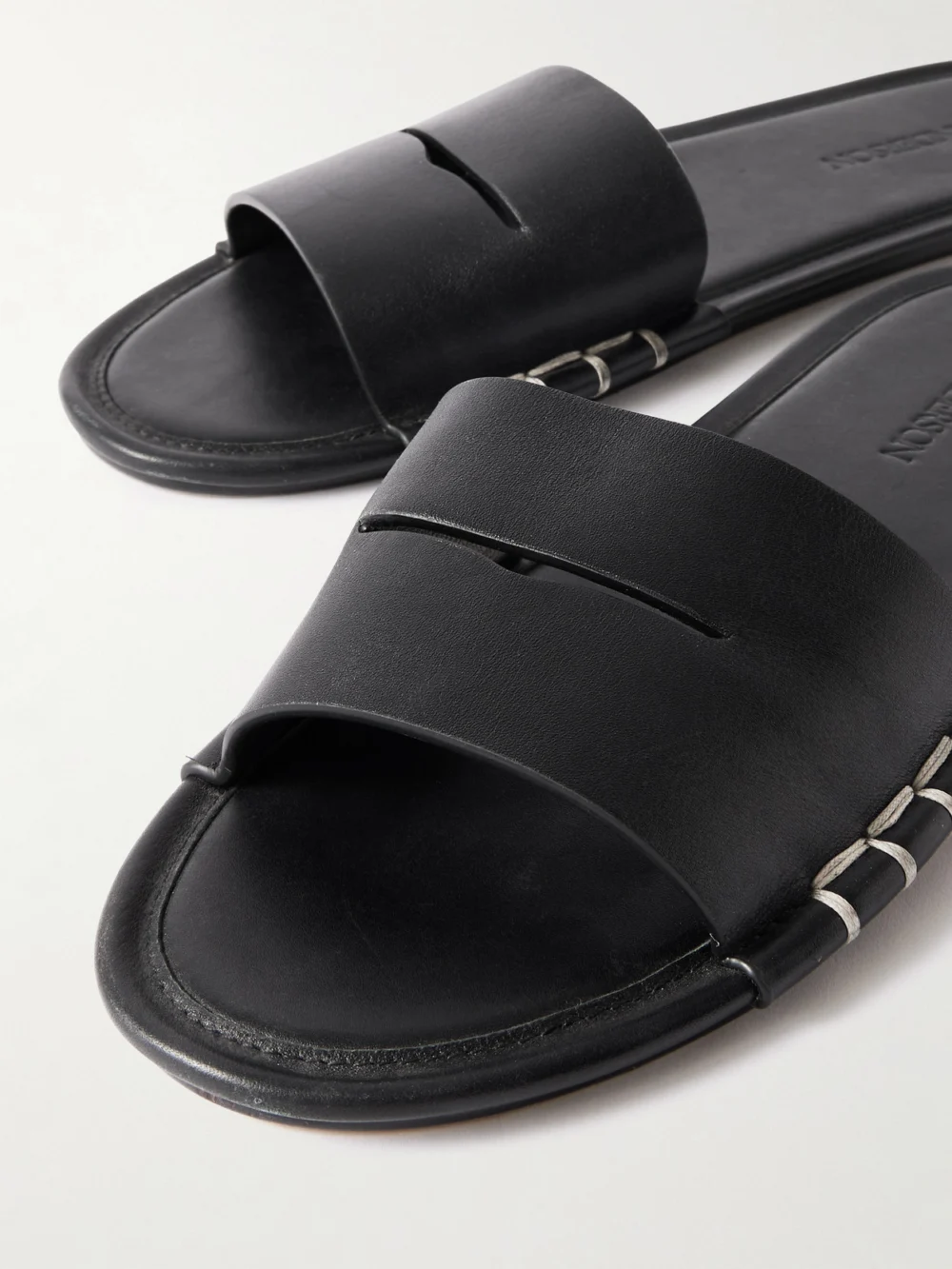 Close-up detail of the JW Anderson Loafer Leather Slides