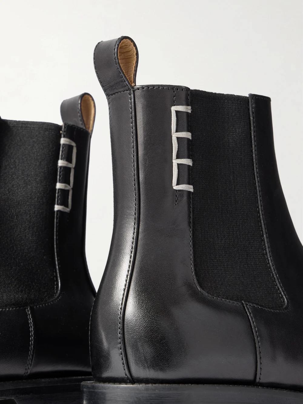 Close-up detail of the JW Anderson Loafer Whipstitched Leather Chelsea Boots