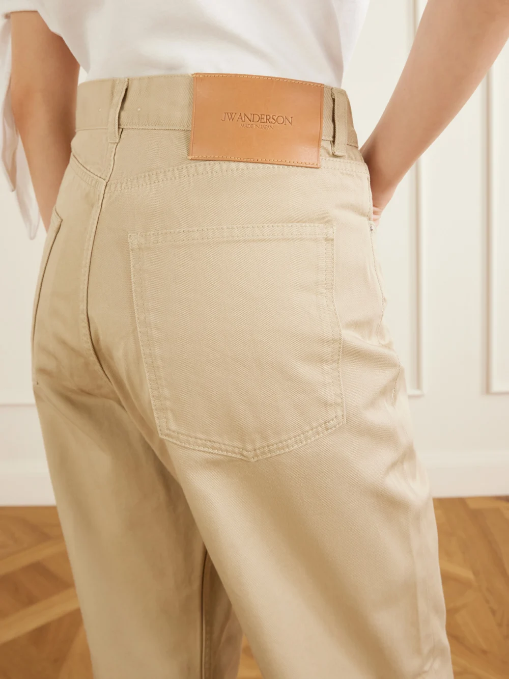 Close-up detail of the JW Anderson Mid-rise Straight-leg Jeans