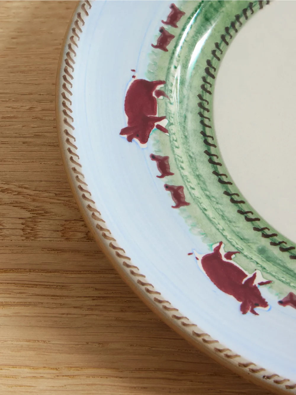 Close-up detail of the JW Anderson + Nicholas Mosse Painted Ceramic Plate