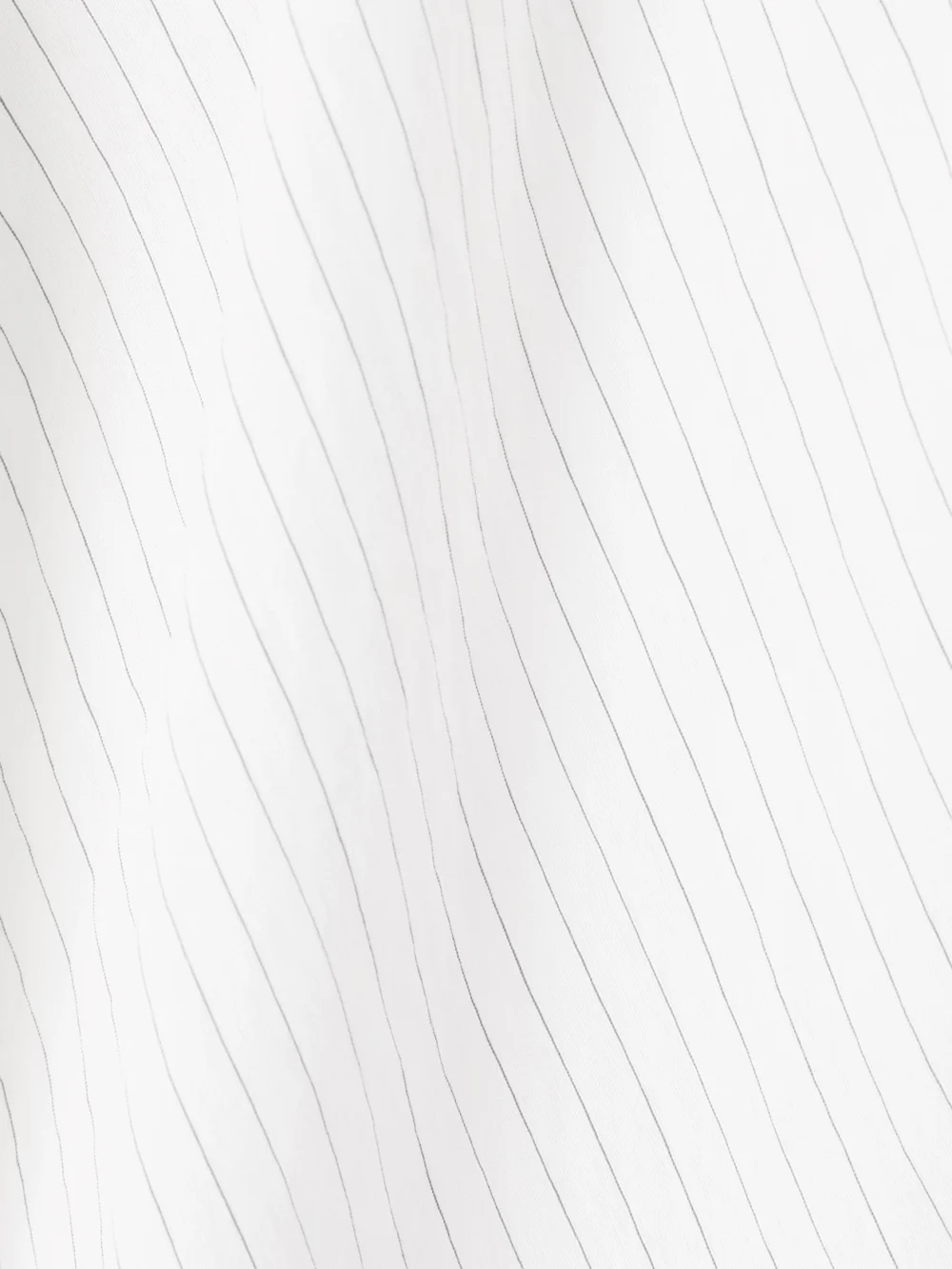 Close-up detail of the JW Anderson Pleated Pinstriped Poplin Mini Skirt