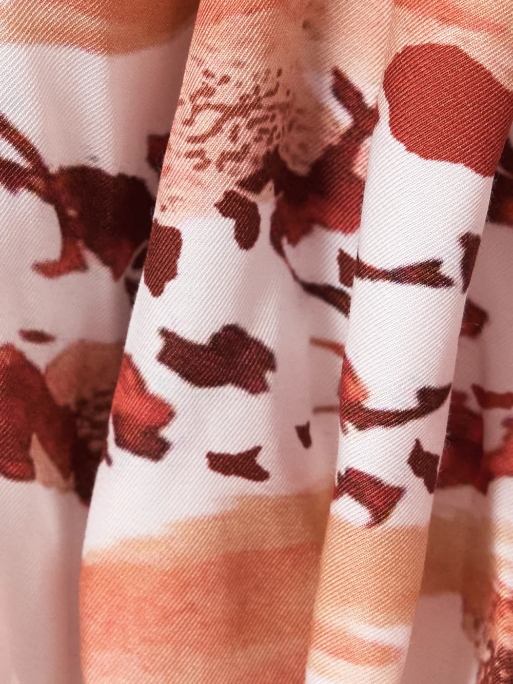 Close-up detail of the JW Anderson Pleated Printed Twill Mini Skirt