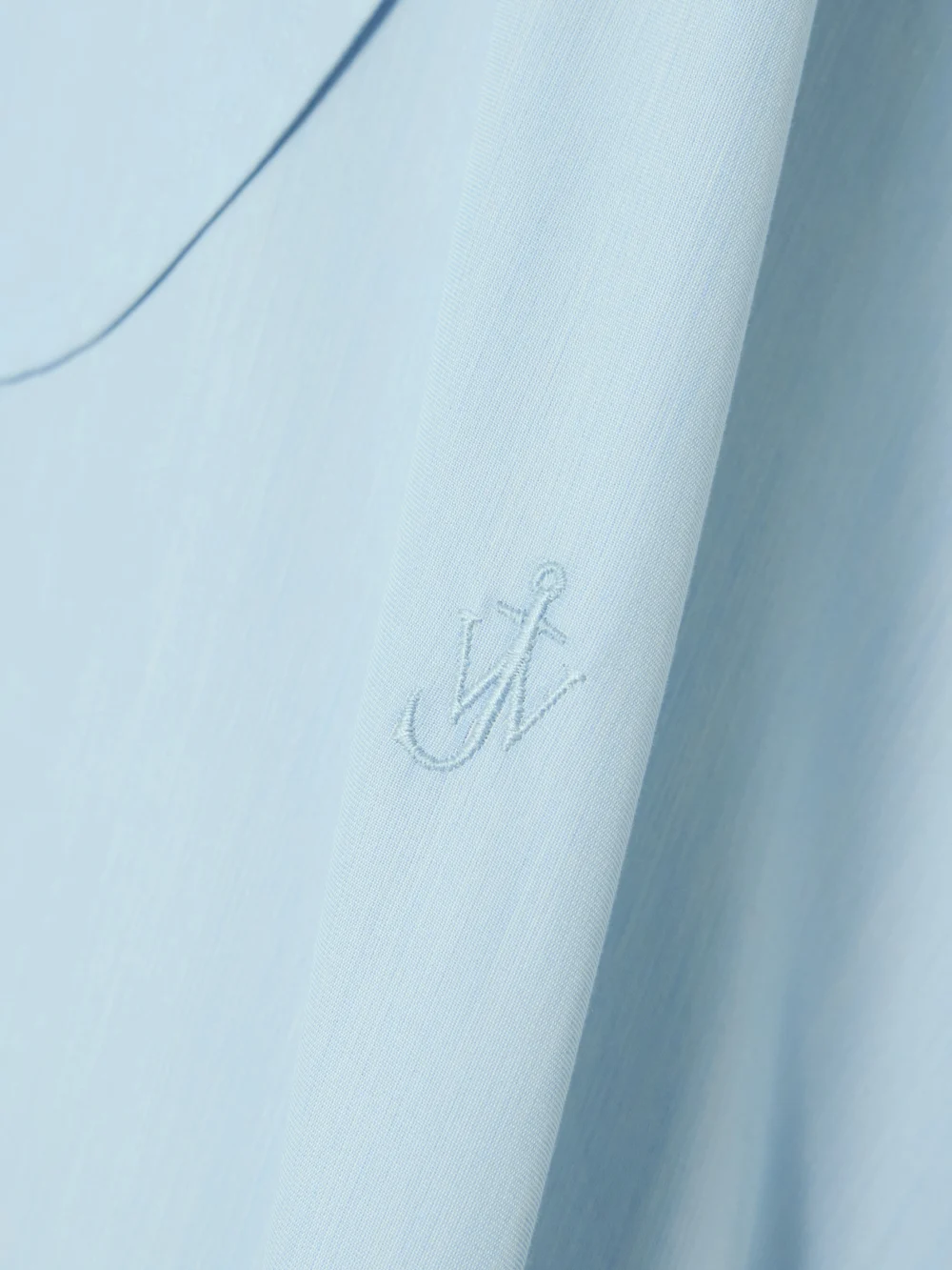 Close-up detail of the JW Anderson Tie-detailed Cotton and Silk-blend Mini Shirt Dress