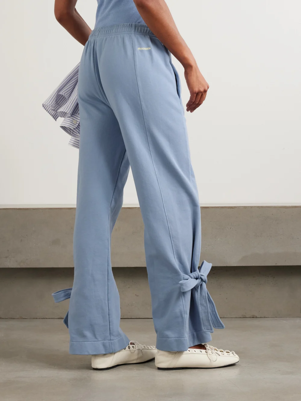 Back view of the JW Anderson Tie-detailed Cotton-jersey Straight-leg Sweatpants