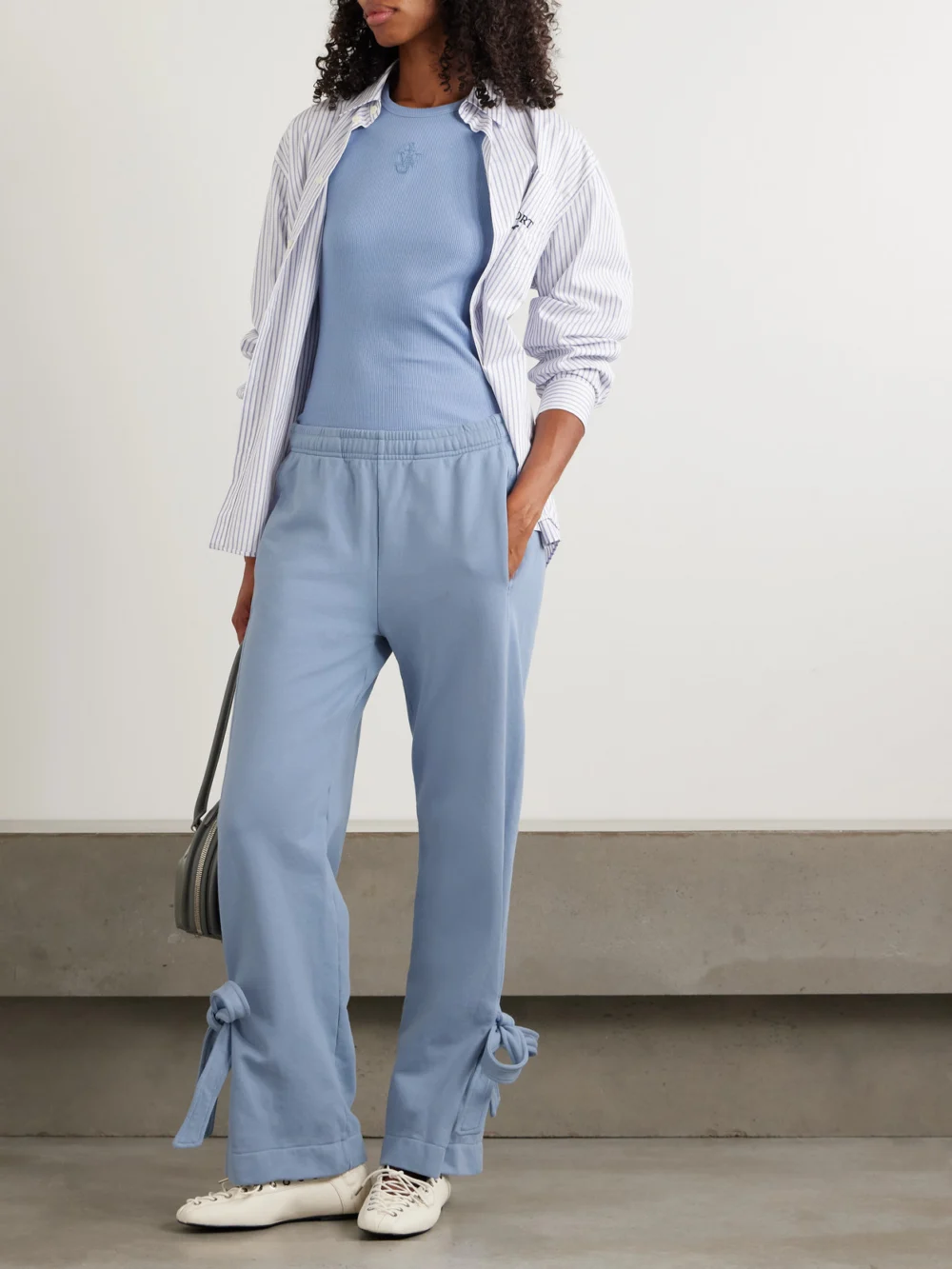 JW Anderson Tie-detailed Cotton-jersey Straight-leg Sweatpants, worn by a model