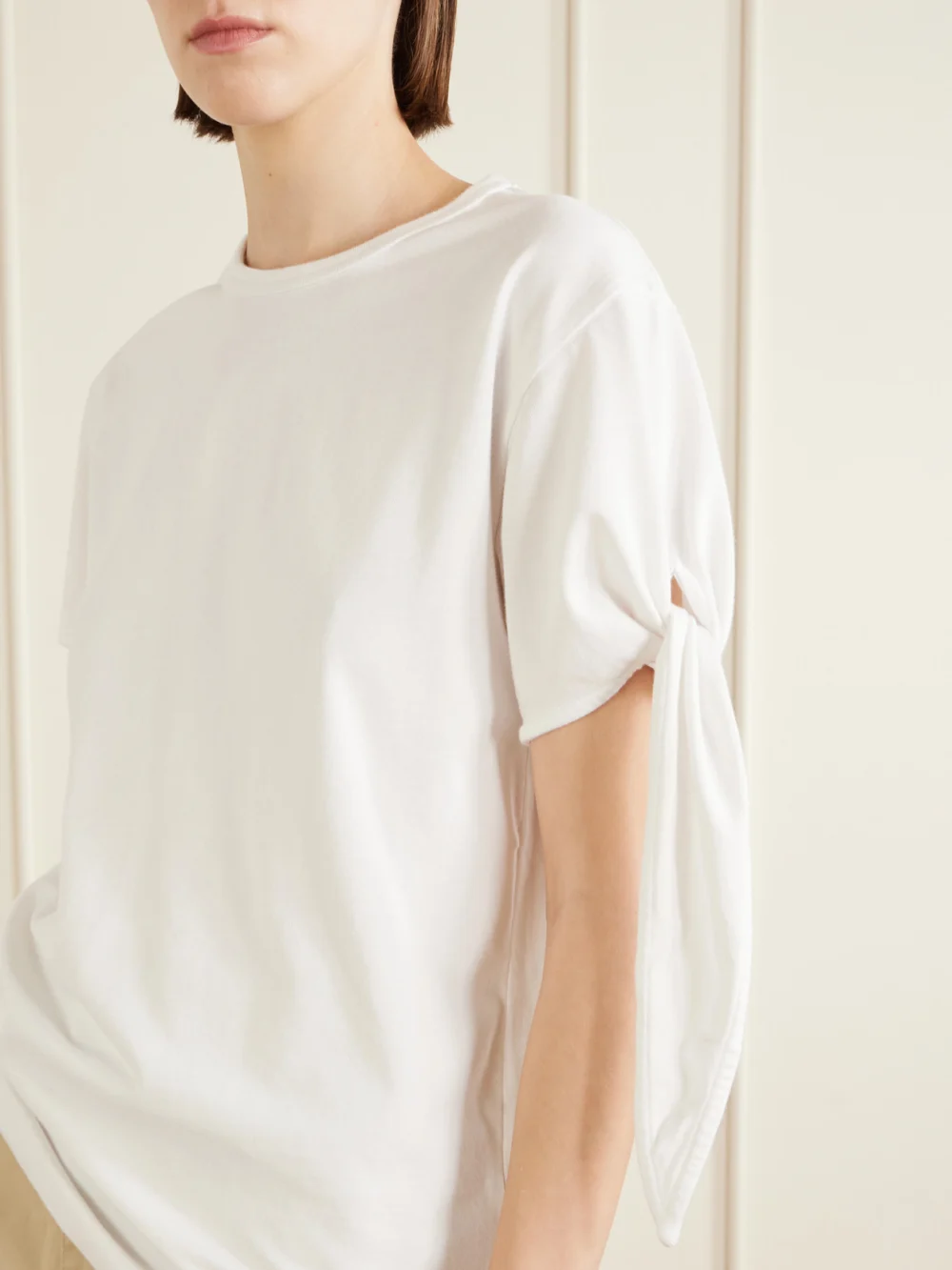 Close-up detail of the JW Anderson Tie-detailed Cotton T-shirt
