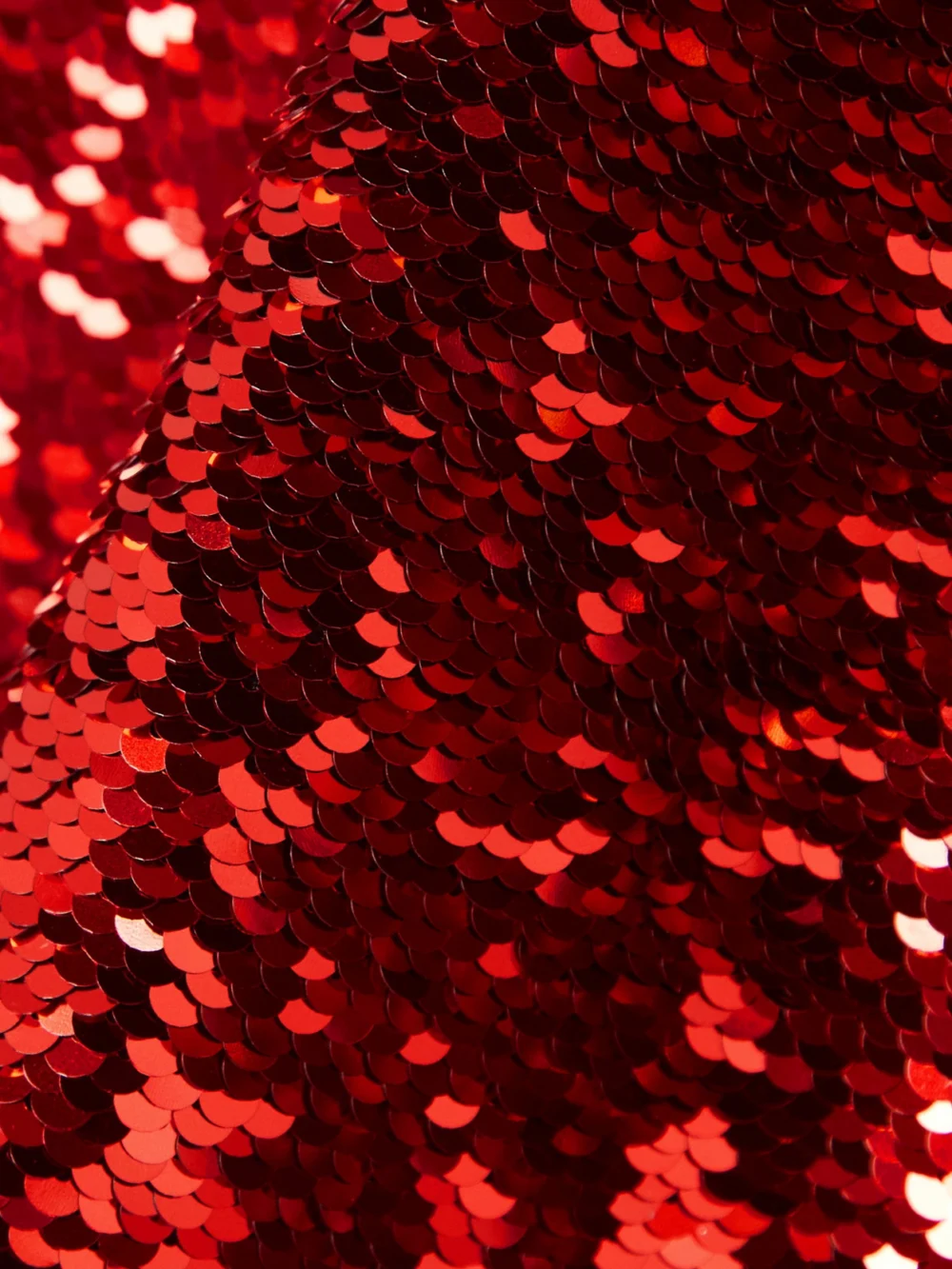 Close-up detail of the JW Anderson Tie-detailed Sequined Satin Top