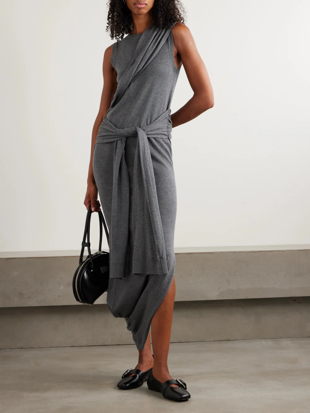 JW Anderson Tie-detailed Wrap-effect Knitted Maxi Dress, worn by a model