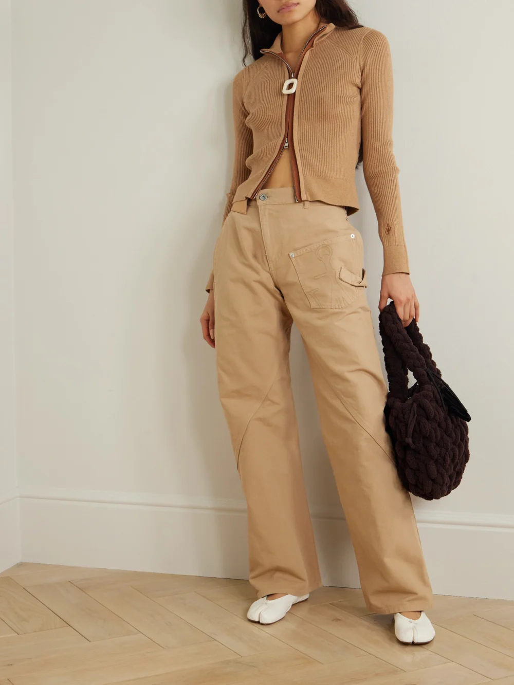 JW Anderson Twisted Asymmetric Embroidered Cotton-canvas Pants, worn by a model