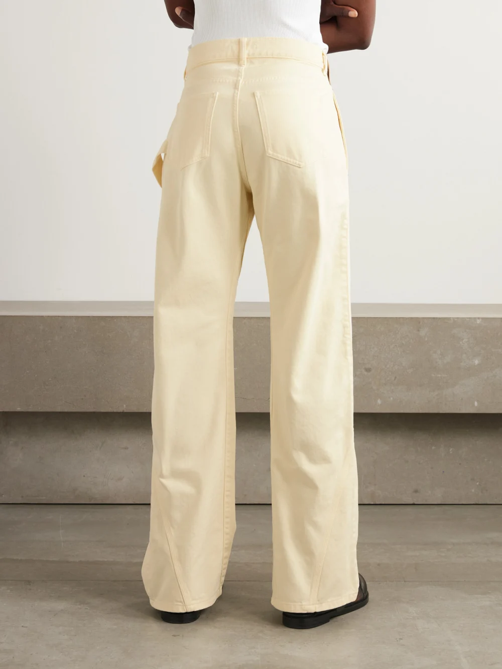 Back view of the JW Anderson Twisted Low-rise Wide-leg Jeans