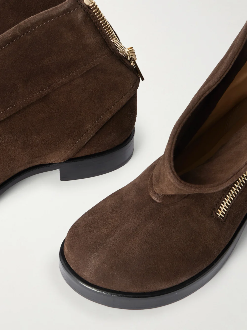 Close-up detail of the JW Anderson Zip-detailed Suede Ankle Boots