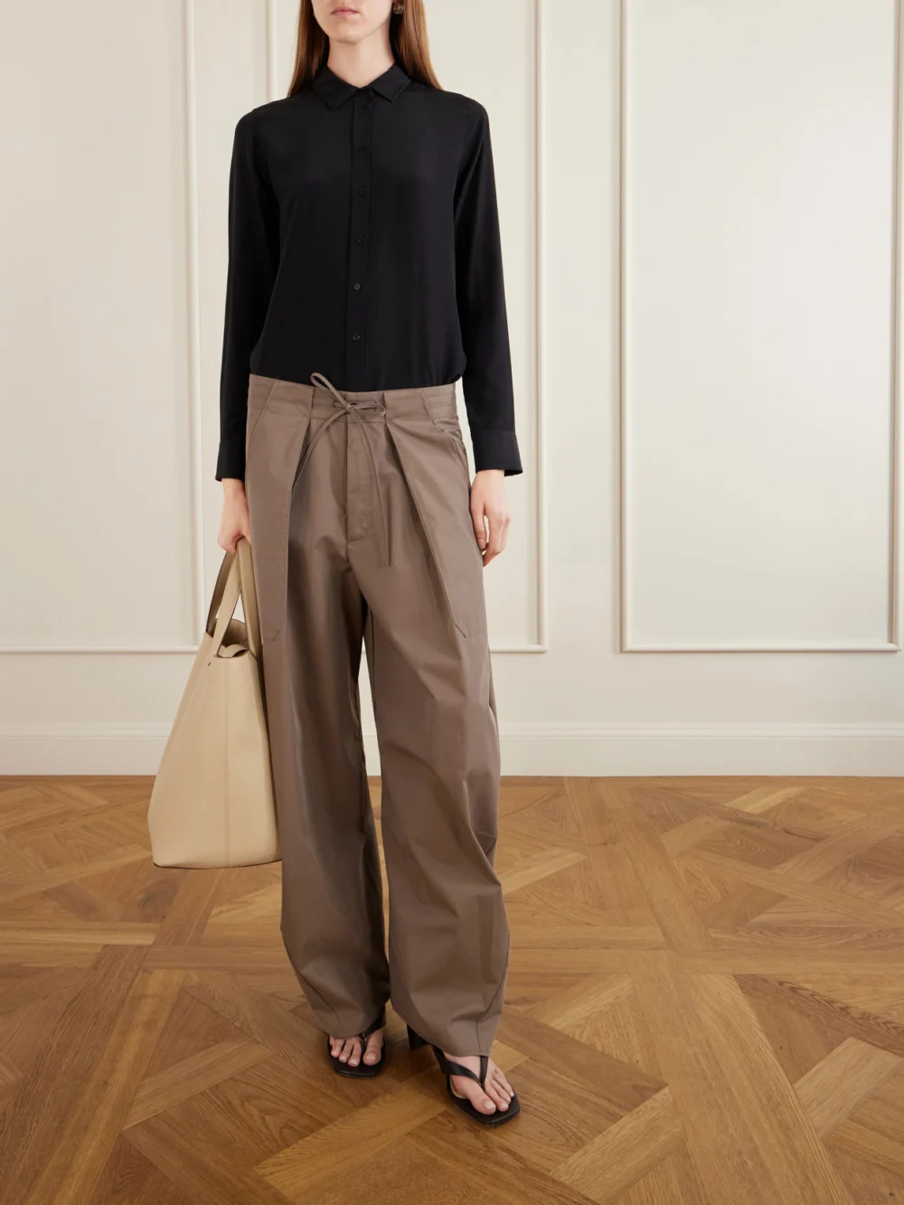 Kallmeyer Clemence Pleated Cotton-blend Twill Barrel-leg Pants, worn by a model