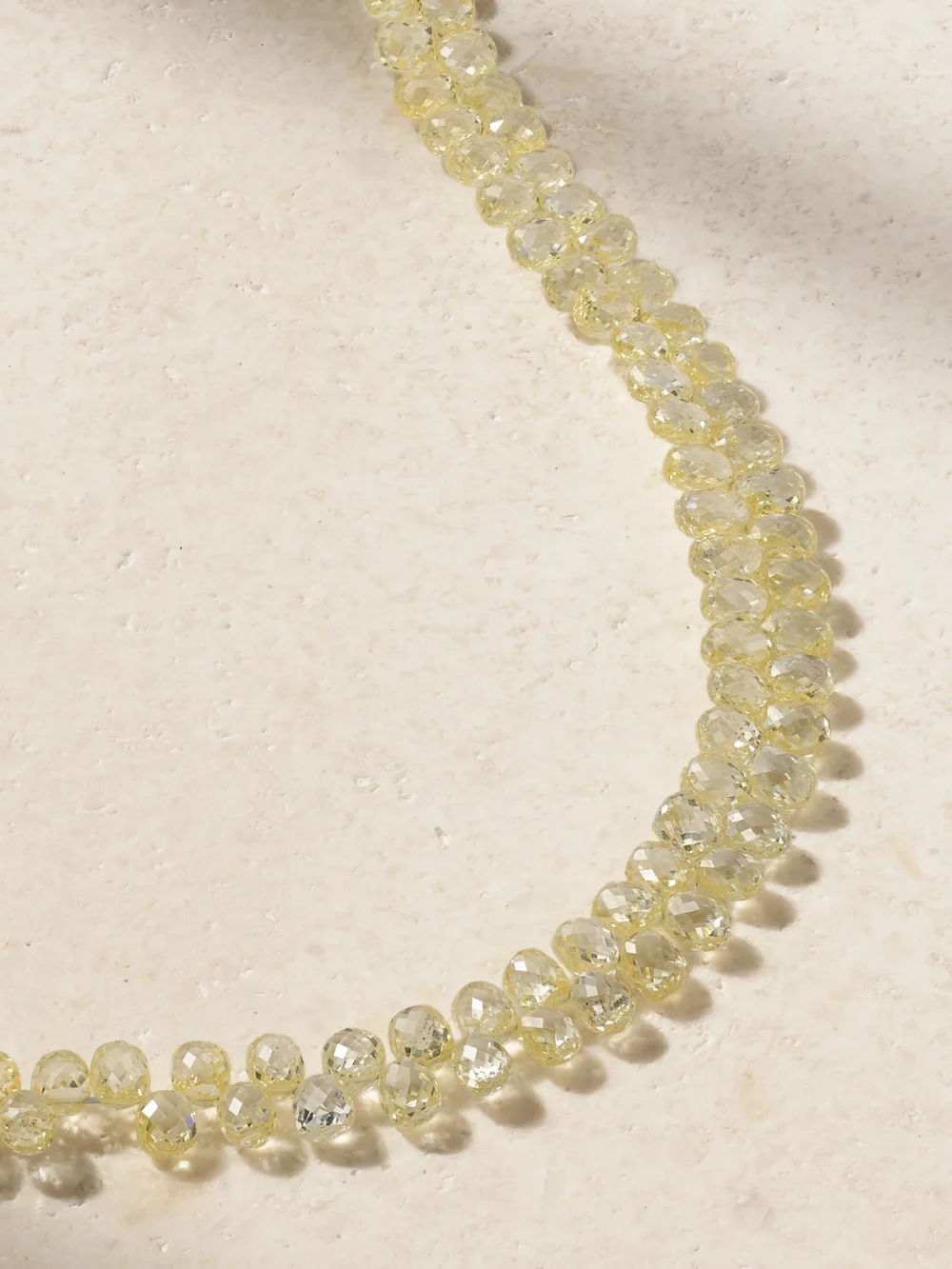 Close-up detail of the Kamyen 18-karat Yellow and White Gold, Diamond and Emerald Bracelet