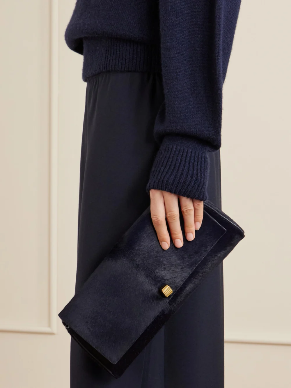 Khaite Audrey Calf Hair Clutch, styled view