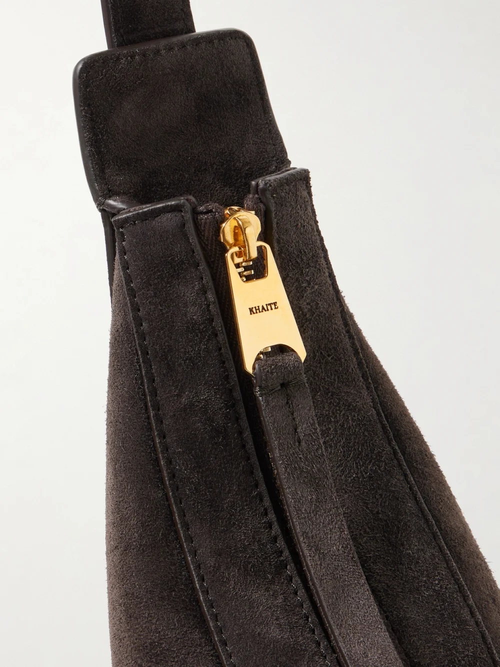 Close-up detail of the Khaite Augustina Small Suede Shoulder Bag