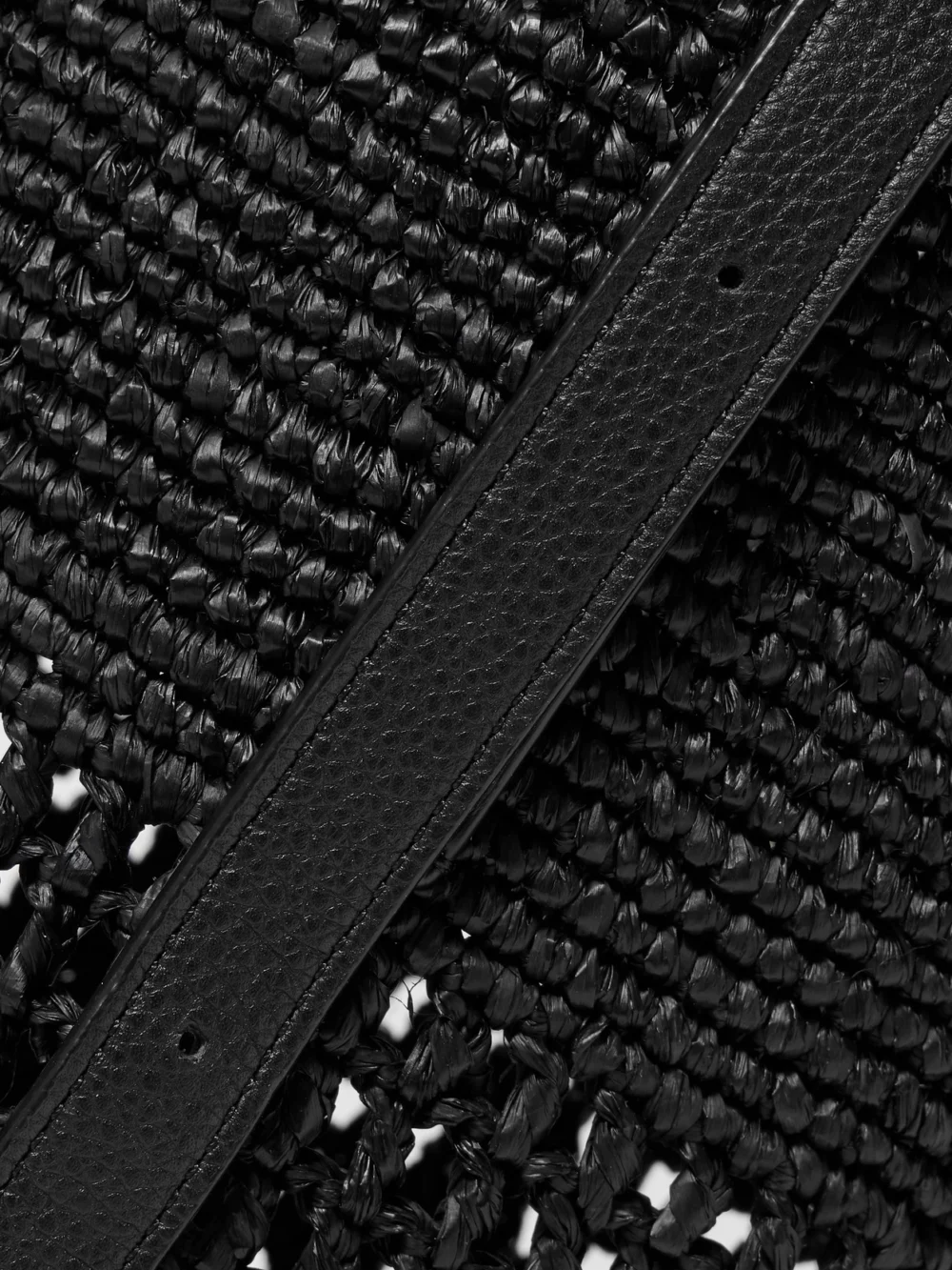 Close-up detail of the Khaite Billie Leather-trimmed Raffia Bucket Bag